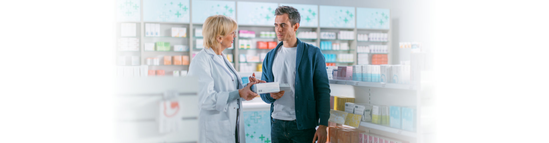 man talking to a pharmacist